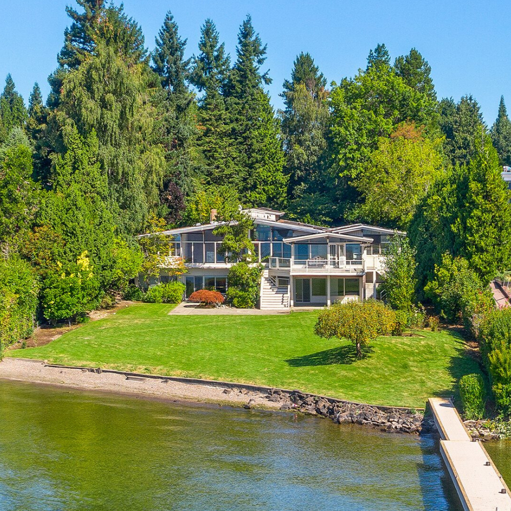 Waterfront property with a dock on Medina’s prestigious Gold Coast, next door to Jeff Bezos home