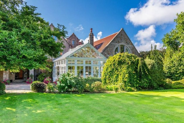 Glass modern greenhouse in the UK